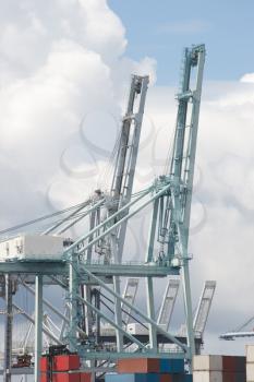 Royalty Free Photo of a Port Crane Against a Cloudy Sky