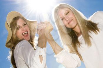 Royalty Free Photo of Two Women Holding Hands
