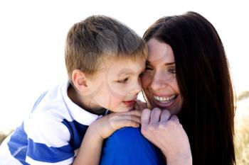 Royalty Free Photo of a Mother and Son at the Beach