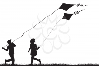 Silhouettes of children flying kites 