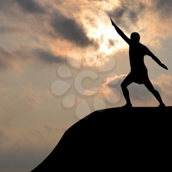 Silhouette of man practicing yoga outdoor