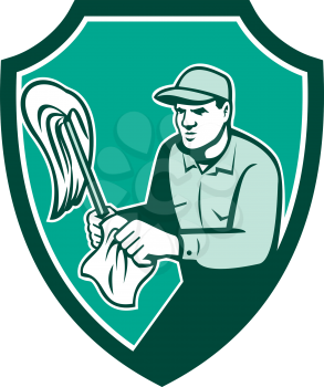Illustration of a janitor cleaner worker standing holding mop and cleaning cloth wipes set inside shield crest on isolated background done in retro style. 