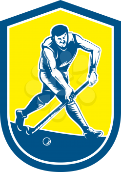 Illustration of a field hockey player running with stick striking ball set inside oval shape done in retro woodcut style on isolated background.
