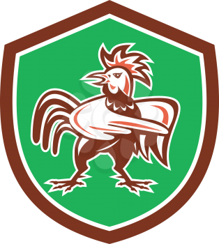Illustration of a chicken rooster angry pointing to the side set inside shield crest on isolated background done in retro style. 