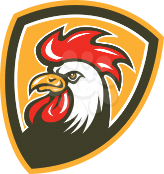 Illustration of a chicken rooster head mascot facing side set inside shield crest on isolated background done in retro style. 