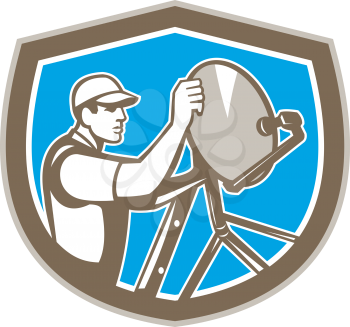 Illustration of a TV satellite dish installer set inside shield crest on isolated background done in retro style. 