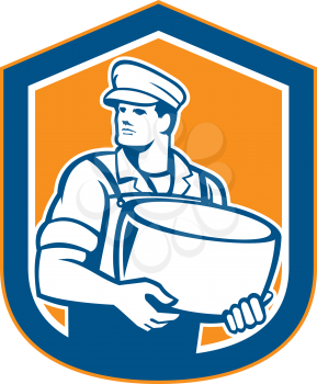 Illustration of a cheesemaker standing holding parmesan cheese block facing to side set inside shield on isolated background done in retro style.