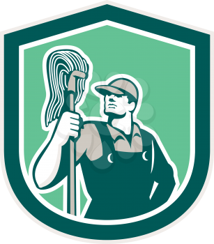 Illustration of a janitor cleaner worker holding mop standing viewed from front set inside shield crest on isolated background done in retro style. 