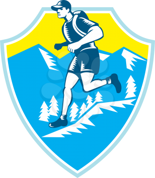Illustration of a cross country runner running viewed from the side set inside shield crest with mountains and trees in the background done in retro style.