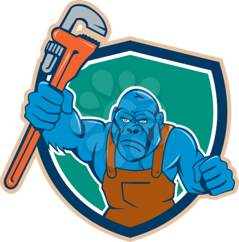 Illustration of an angry gorilla ape plumber with monkey wrench punching facing front set inside shield crest on isolated background done in cartoon style. 