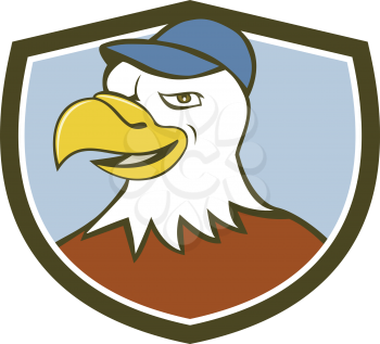 Illustration of an american bald eagle head wearing hat smiling looking to the side set inside shield crest on isolated background done in cartoon style.