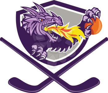 Illustration of a purple dragon head breathing fire clutching an ornage ball with crossed hockey stick set inside shield on isolated white background done in retro style. 