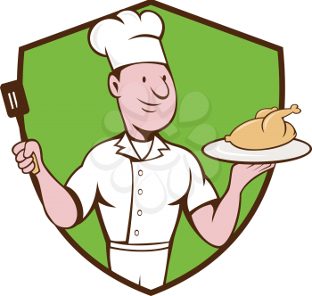 Illustration of a chef cook serving roast chicken on a platter on one hand and holding a spatula on the other hand viewed from front set inside shield crest on isolated background done in cartoon styl