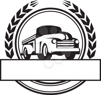 Illustration of a vintage pick up truck set inside circle with stylized wheat wreath and banner done in black and white retro style. 