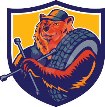 Mascot icon illustration of bust of a bear tireman or tire man, holding a tire wrench or socket with tyre slung over shoulder set inside crest shield on isolated background in retro woodcut style.