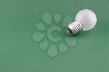 Royalty Free Photo of a Light Bulb on Green