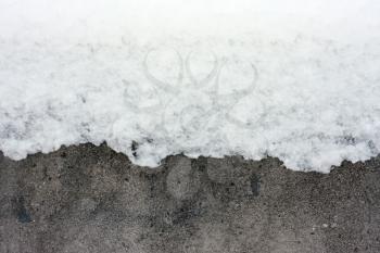 Royalty Free Photo of Snow on a Concrete Wall