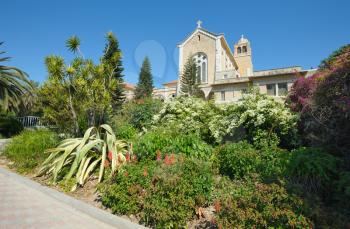 Royalty Free Photo of the Church in the Monastery Latrun Surrounded by Flowers and Trees 