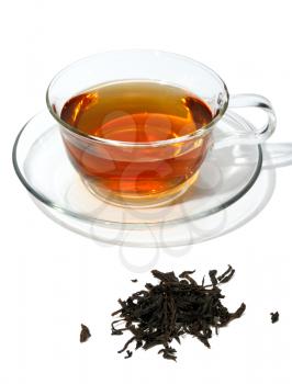 Black tea in a glass cup, on a white background isolated