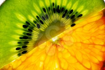 Royalty Free Photo of a Kiwi and Mandarin Slice