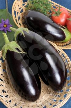 Royalty Free Photo of Eggplants and Other Vegetables in Baskets