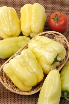 Royalty Free Photo of Yellow Peppers and a Tomato