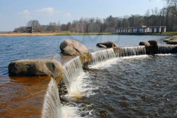Royalty Free Photo of a Lake with a Small Artificial Waterfall in Niasvizh, Belarus