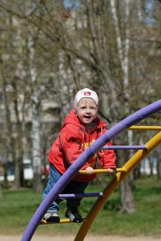 Royalty Free Photo of a Child Playing in a Park