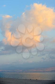 Sea of Galilee in the early morning, ripples on the water and clouds in the sky