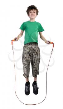 A boy in a green shirt jumping rope, isolated on a white background