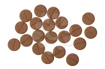 Several brown pills on a white background, isolated