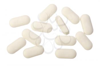 Several white pills on a white background, isolated
