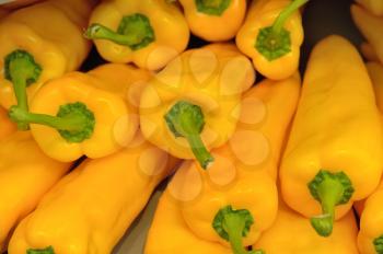 Several pods of yellow sweet pepper, capsicum