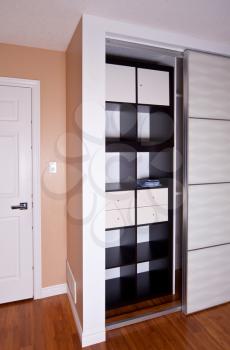 Built-in closet with sliding door shelving storage organization solution, empty shelves