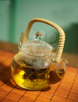 teapot of green asian tea