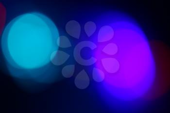 illustration of blurred neon disco light dots pattern on dark background