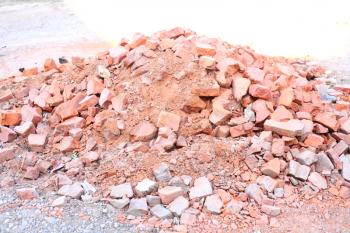 pattern of heap of used demolished red bricks