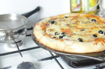Appetizing pizza with mushrooms on a oven