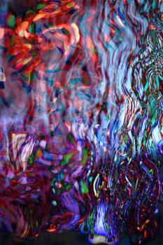 Decorative christmas background - defocused reflection of lights.