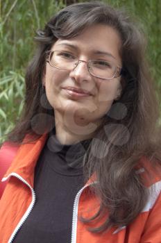 Young woman in orange wear. Outdoor.