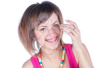 young woman makes a funny face on white studio shot big smile