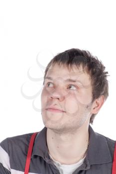 Close-up portrait of handsome young man with serious face looking up