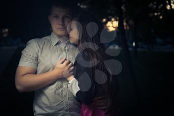 Young couple in love embracing. Toned crossprocess image
