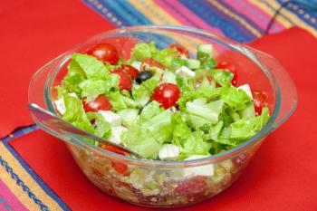 Fresh salad in plate on table