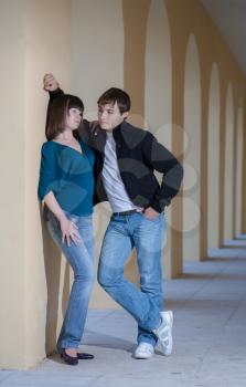 Portrait of a student couple posing outside building in the gallery love relation concept