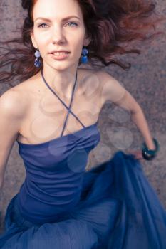 redhead 20s women in blue tank top and skirt dancing salsa outdoor in loneliness, summertime, day