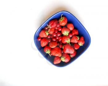Strawberries in aBlue  Bowl, on a light background
