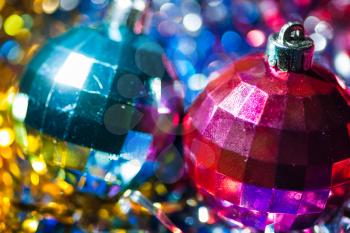 Very closeup shot of the two xmas balls, violet and blue color