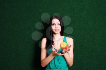 women playing with apple. Red apple in females hands