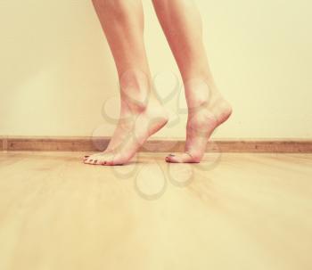 Pretty feet on a floor colorized image